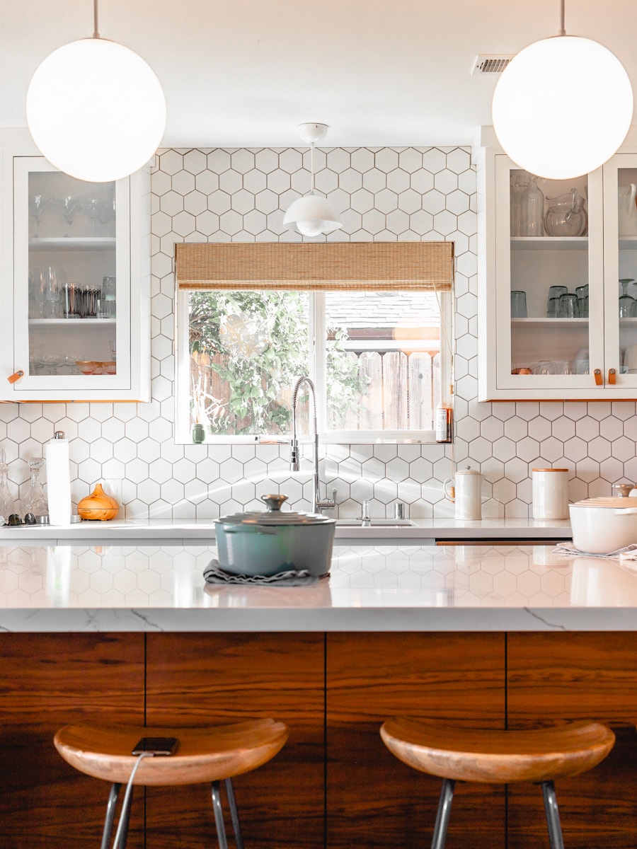 Renovated kitchen with wood island and pendant lighting
