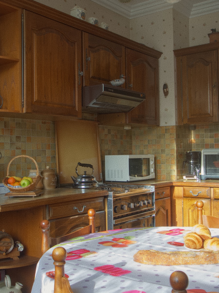Dated wood-cabinet kitchen before renovation