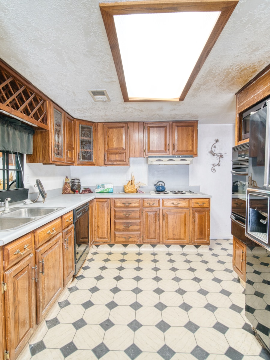 Outdated kitchen with checkered floor before renovation